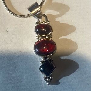 Vintage Sterling Silver cabochon garnet pendant with snake chain.